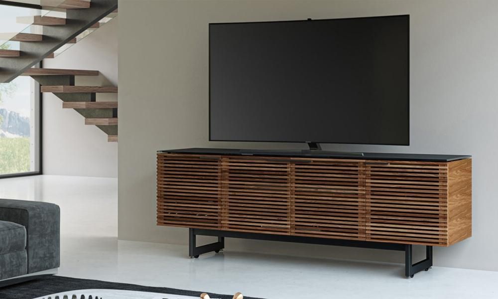 Flat screen TV sitting on top of a console