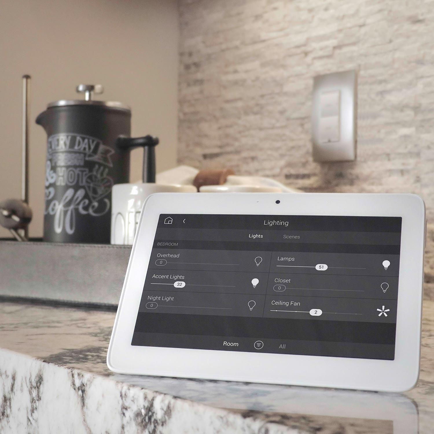 control4 touchpanel on stack of books