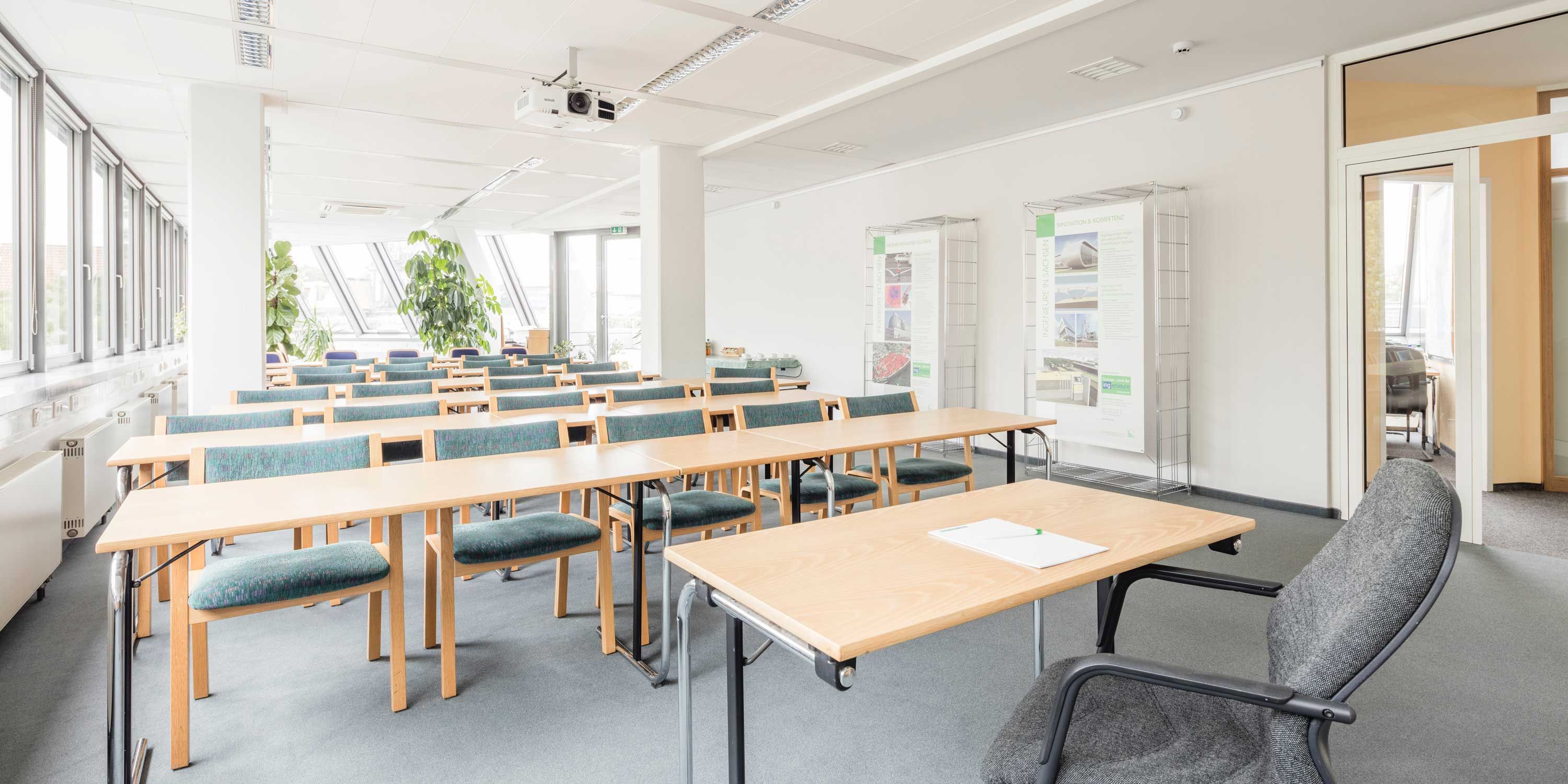 wooden chairs and tables in a training area